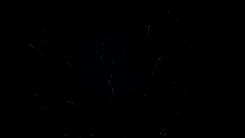 A bright firework going off and scattering in the sky