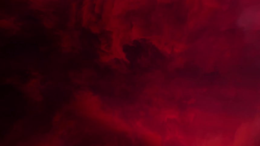 Red and black clouds roil against each other