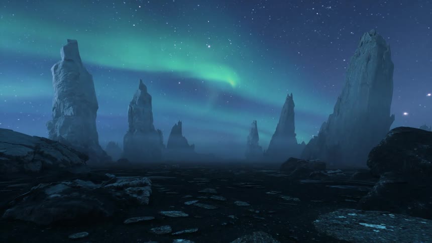 Tall rock formations lined up across the land as the green glow of the aurora borealis shines in a hazy star filled night sky