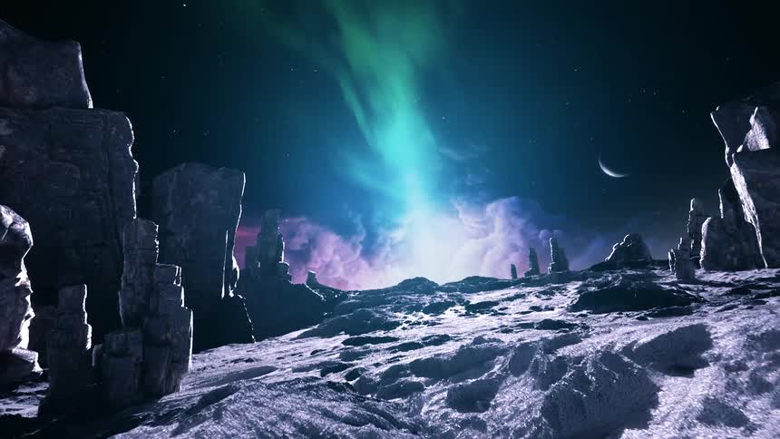 Glowing clouds and a green aurora illuminate the surface of a barren planet covered with rocks and rock formations