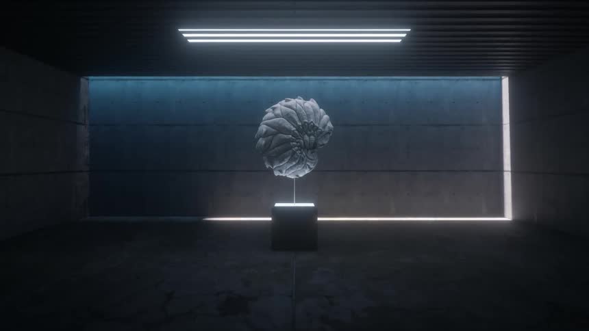 A sculpted organic creature on display in a concrete room