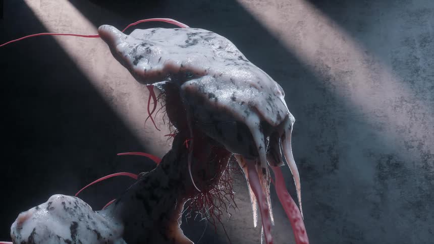 A white and grey alien looking sculpture with red and white tentacles