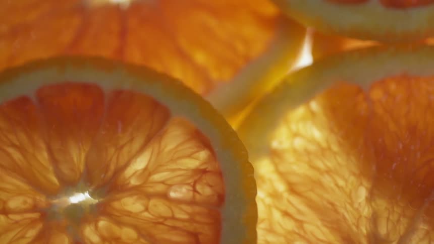 Orange slices are in a pile together