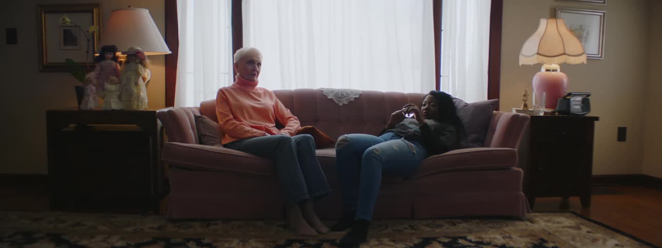 Two women resting on a couch