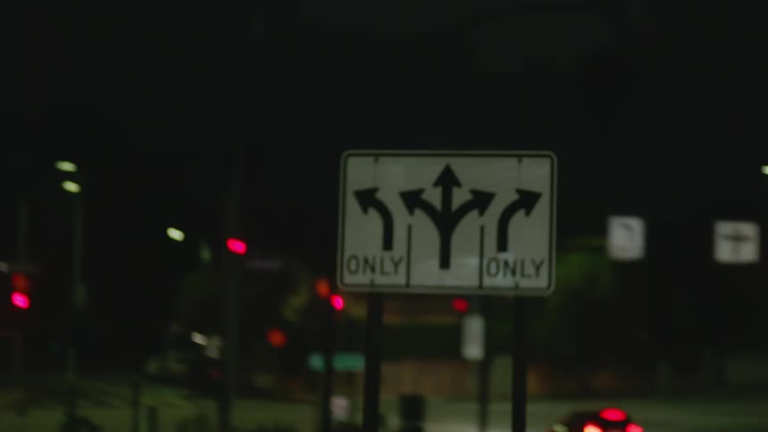 A view of cars driving outdoors at night