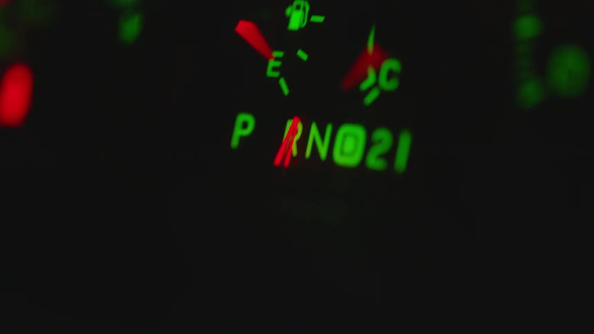 A needle moving on a dashboard in a vehicle