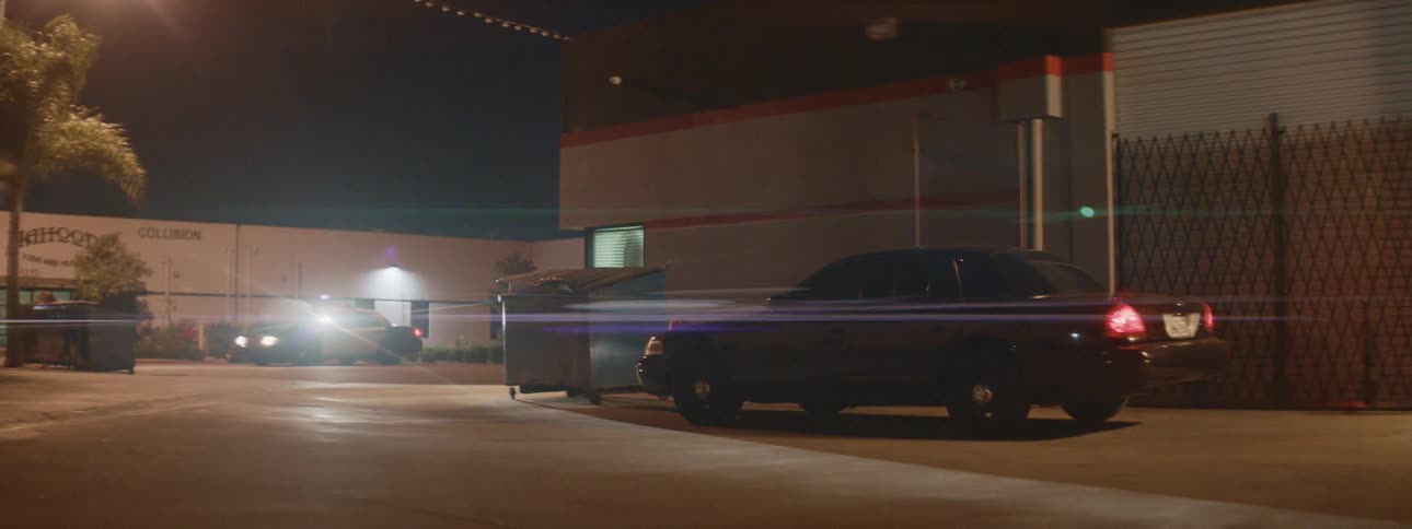 A car flees from a police car