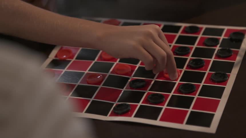 A person playing checkers