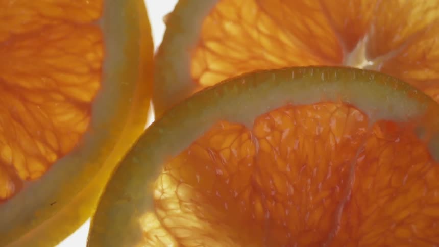 Orange slices lay in a stack