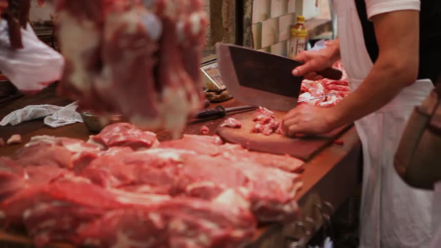 Butchers chopping meat in Hong Kong Market
