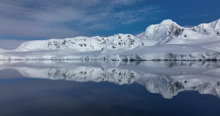 Snowy coast and serene waters