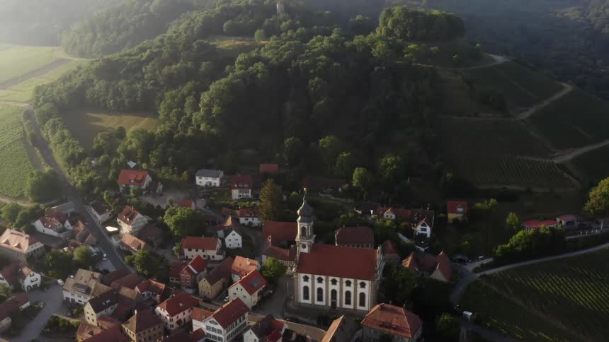Homes in a rural community are situated around a church