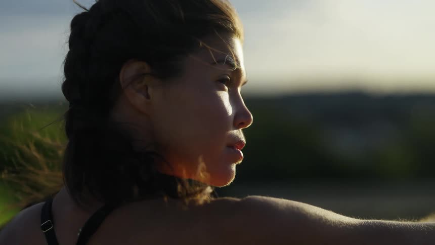 A woman is outside on a windy day