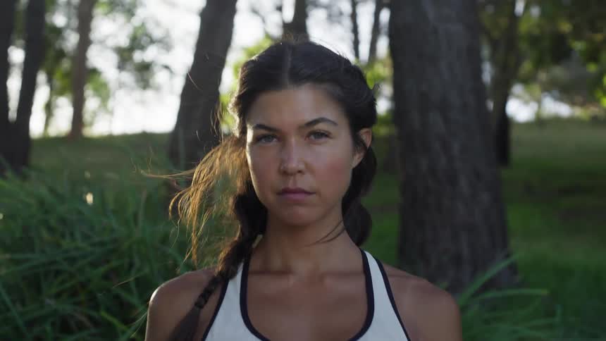 Pretty girl standing in wilderness area on a breezy day