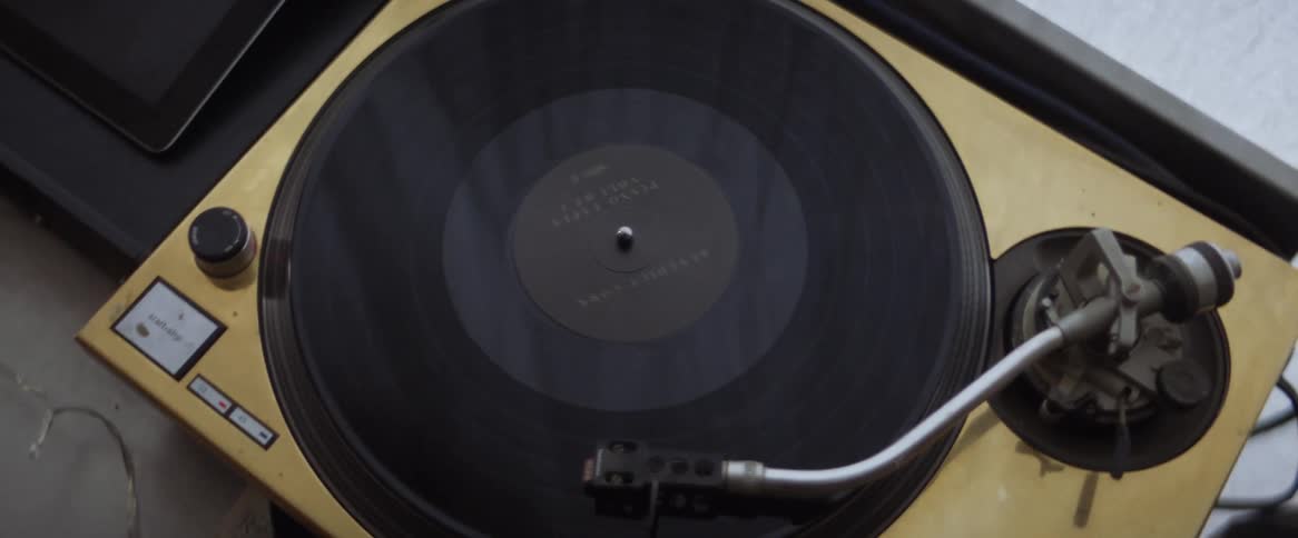 A vinyl record spins on a record player