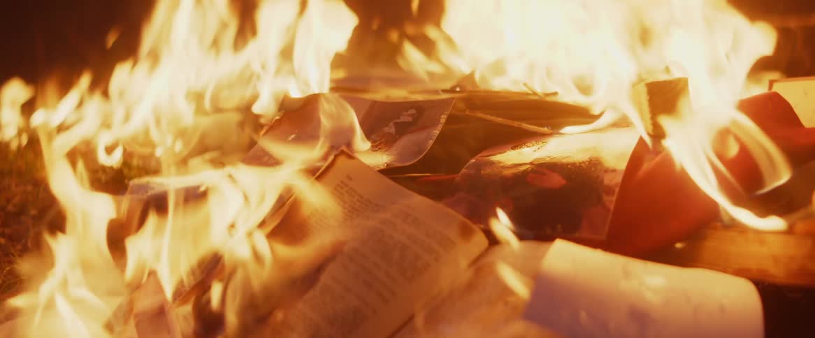 Paperback books burn in a fire