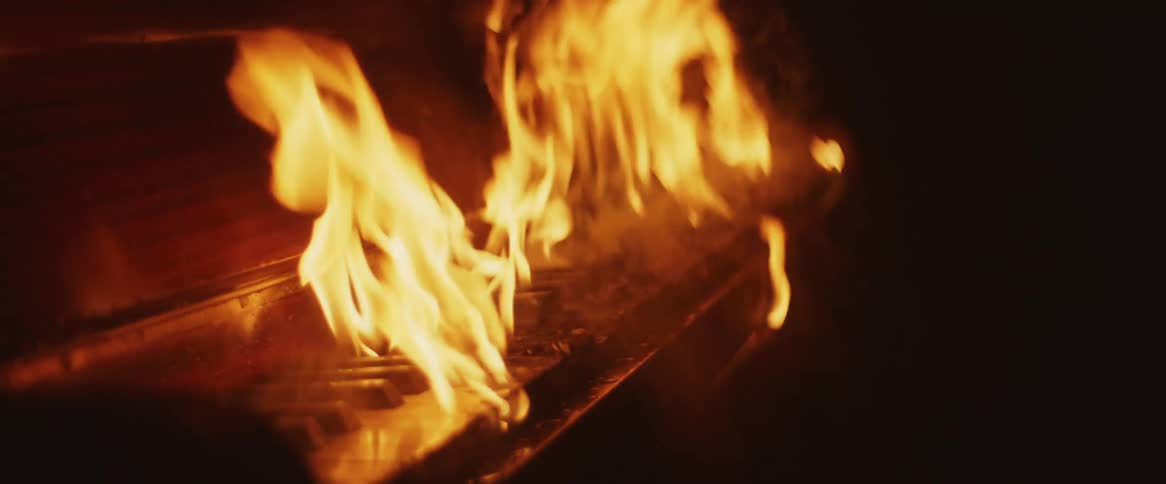 A piano instrument is caught on fire