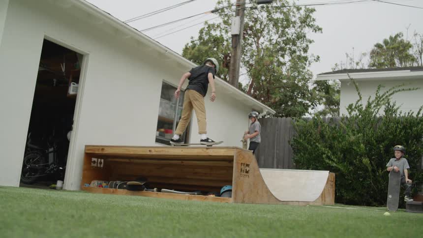 Kids skateboarding in the backyard