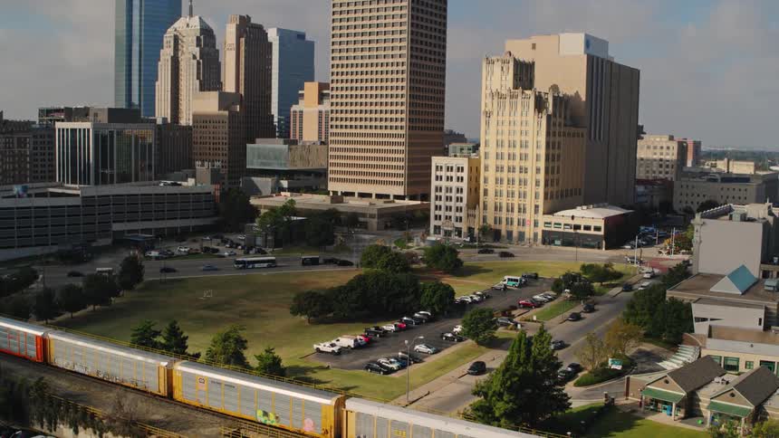 A shot of train and a parkign lot