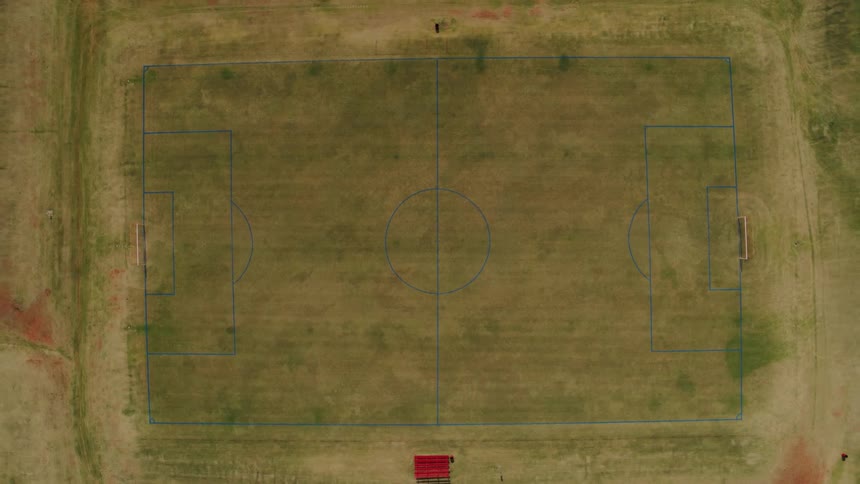 A soccer court is drawn with blue lines with nets at the goals