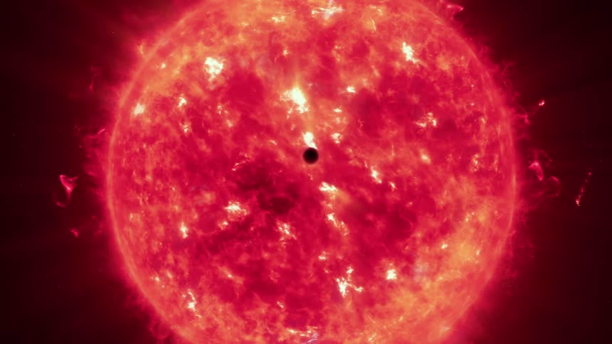 A planet moving past a burning sun