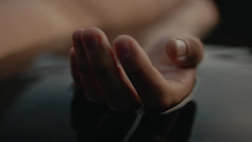 Close up view of a human body laying in water