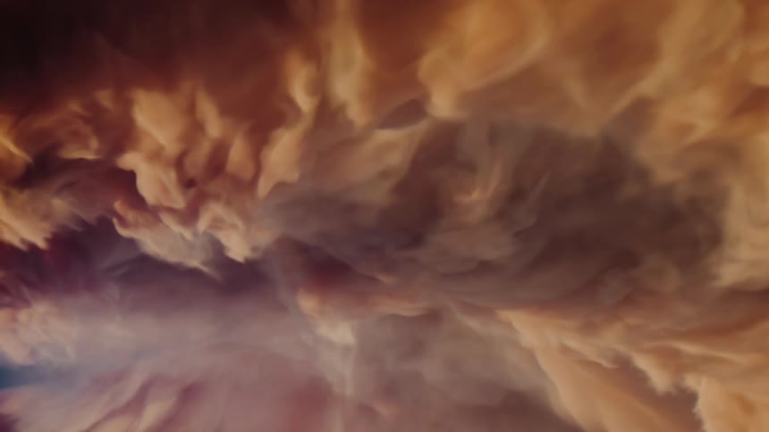 Lightning flashes through break in red tinted clouds of Jupiter