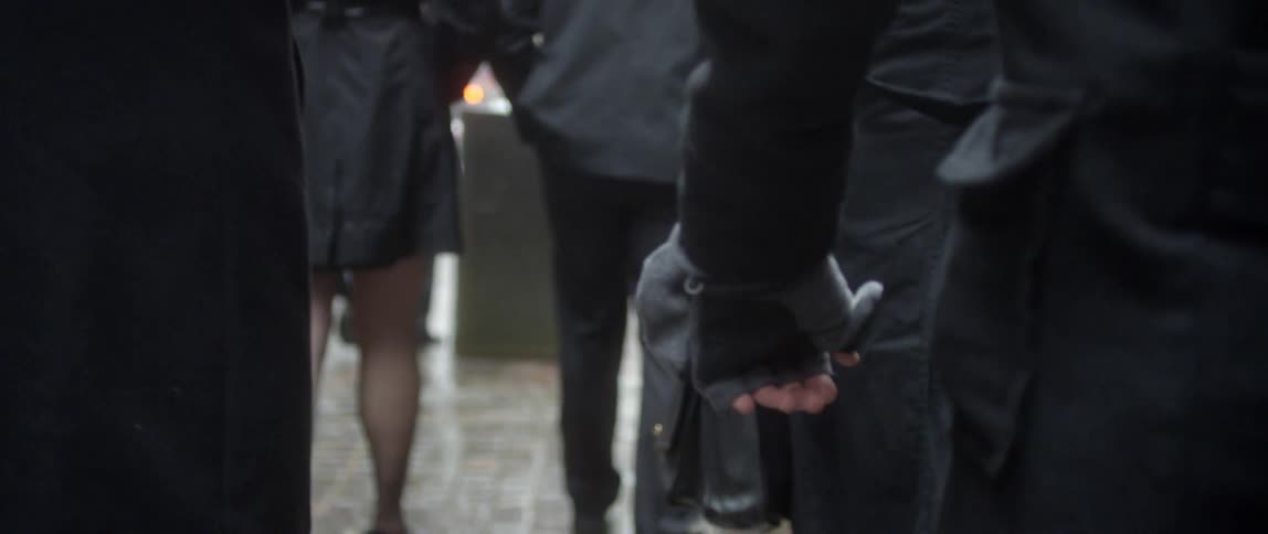 People walking on a wet pathway
