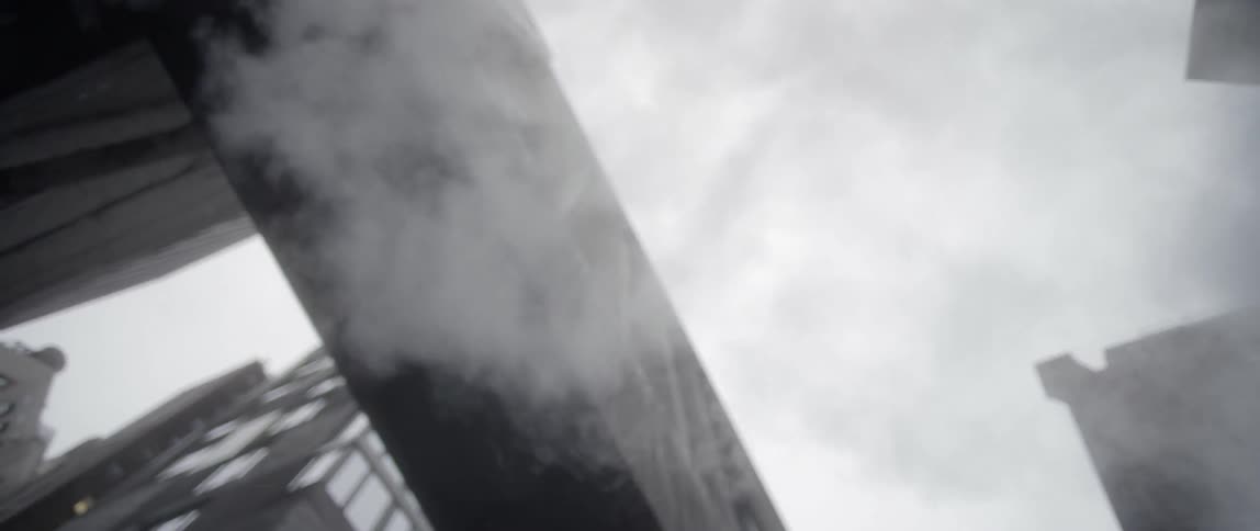 Steam travels in the air above this street