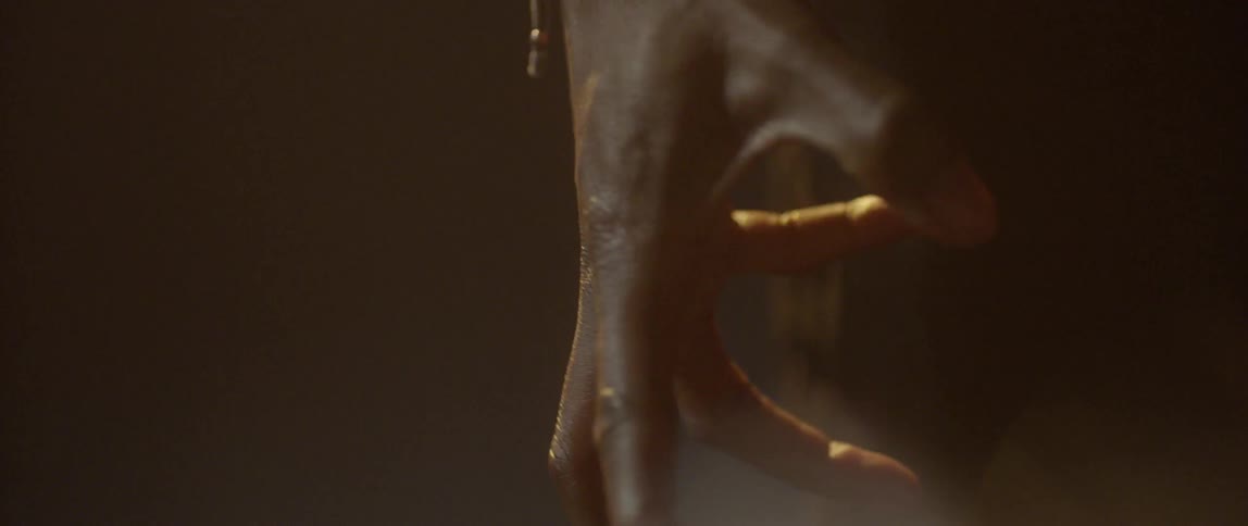 A man clenching and unclenching his fingers