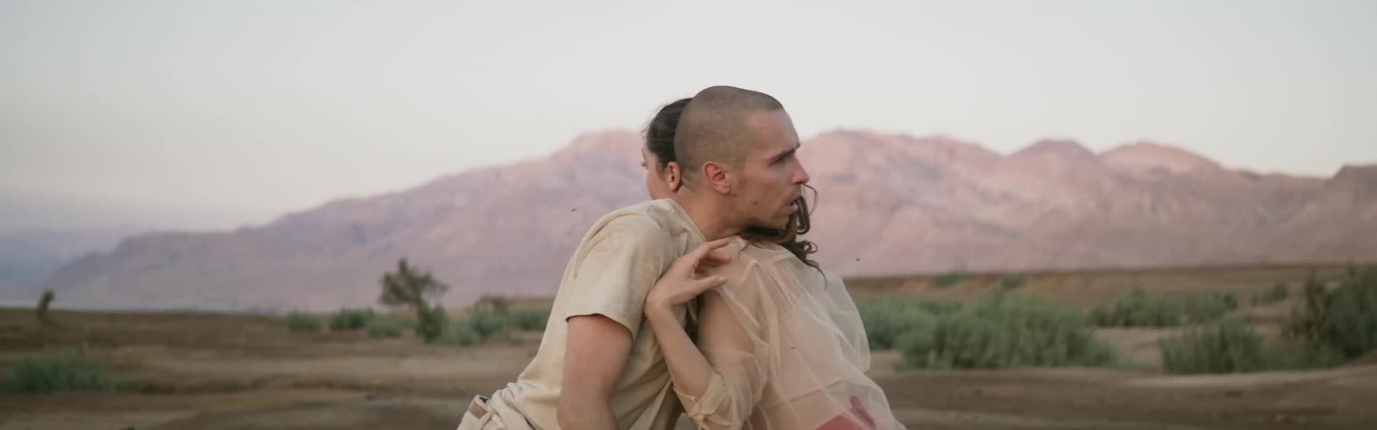 A man is pushing against a woman
