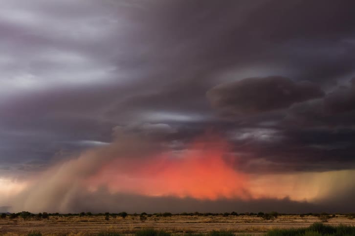 Dust wall/dust foot moves across the desert