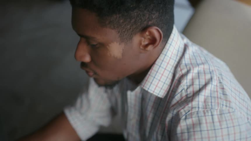 A man is typing on his keyboard