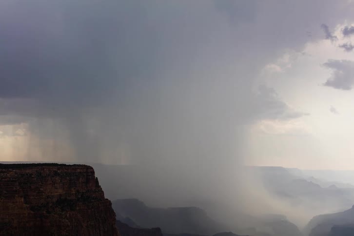A monsoon downburst forming and rolling over the Grand Canyon