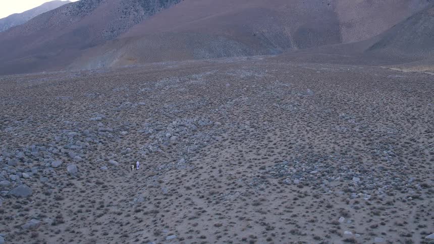 A desert leads to a mountain