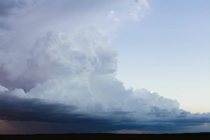 Dark clouds form over a field