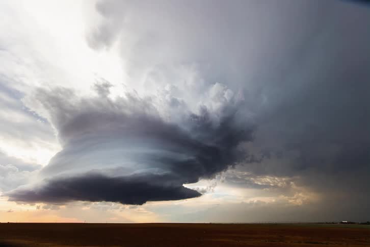 An incredibly supercell with mothership structure over the farm lands