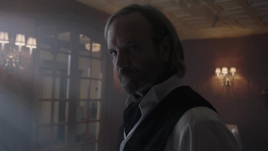 Light shines on a man in a room