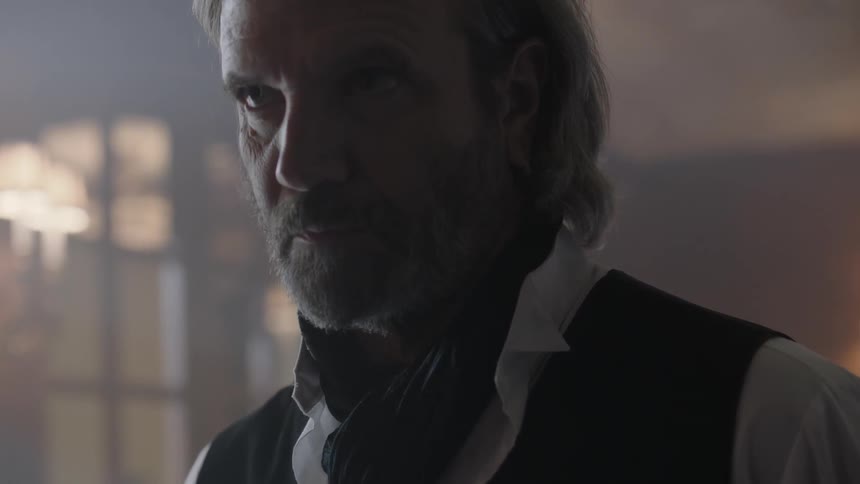 A man glancing up from whatever he was gazing at