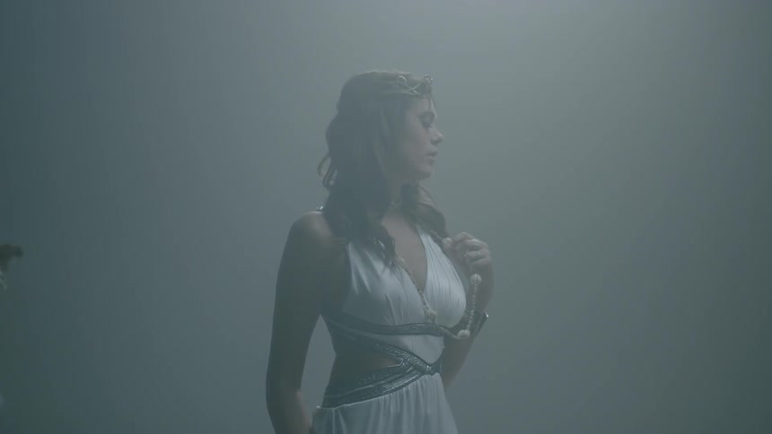 Long-haired woman wearing a beautiful gown