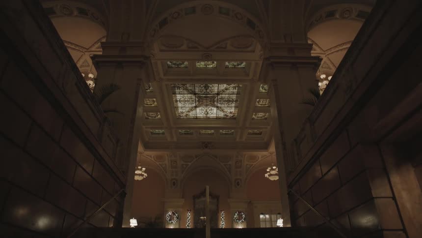 A large hall has windows in the ceiling in parts