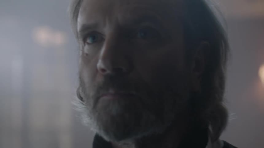 A man walks up and looks forward