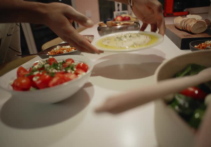 Men serve dishes for dinner