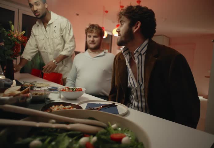 Friends sit down to have dinner together
