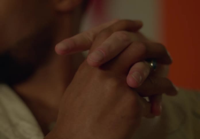 Close up of gay men holding hands