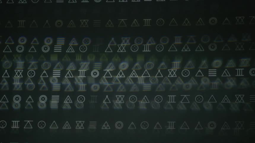 Lines of shapes flash on a screen