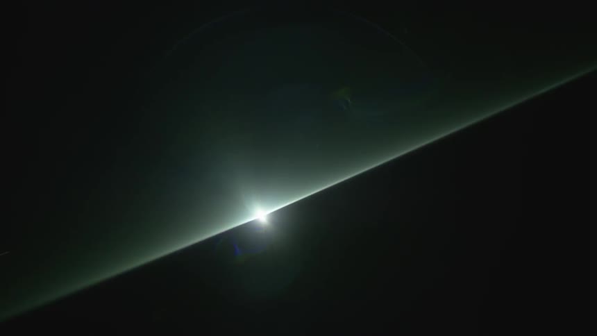 A light beam shines through darkness