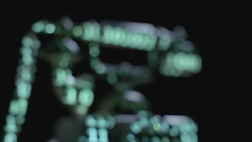 Illuminated numbers being projected on an antique rotary phone