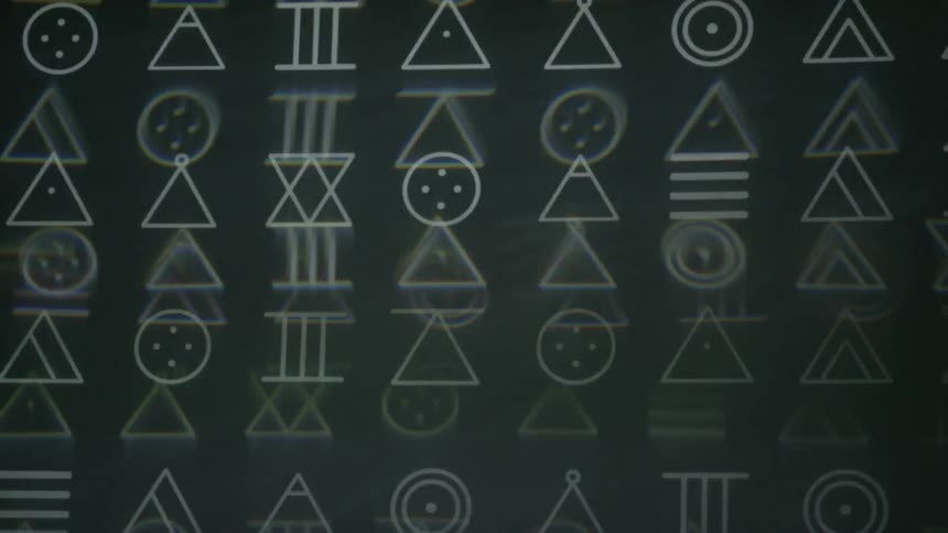 Shapes flash and pulse on a screen