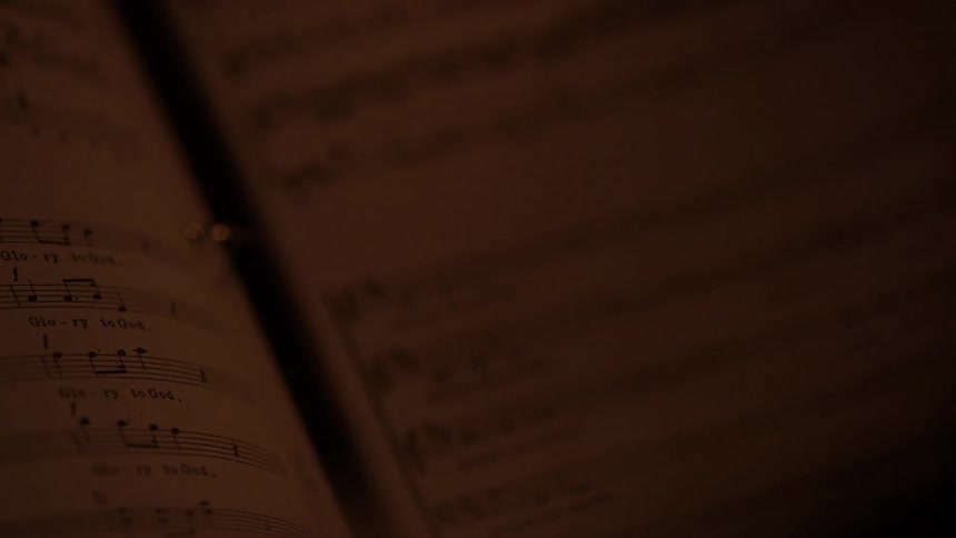 Pages in a book are dimly lit